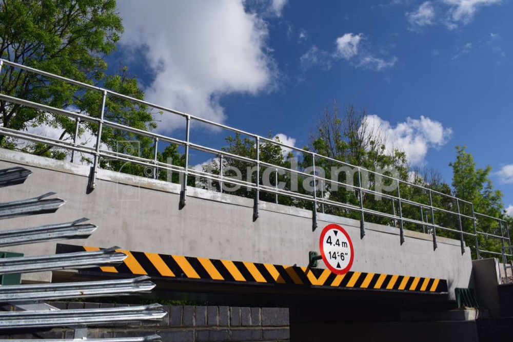 Interclamp key clamp fittings used to construct a guardrailing during a bridge replacement project on a railway line, providing a secure barrier for workers.